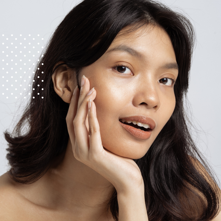 woman touching her face