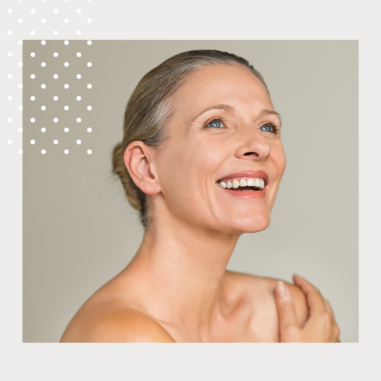 Woman applying skincare cream to face