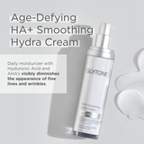 Glytone Age-Defying HA+ Smoothing Hydra Cream bottle on a light gray background